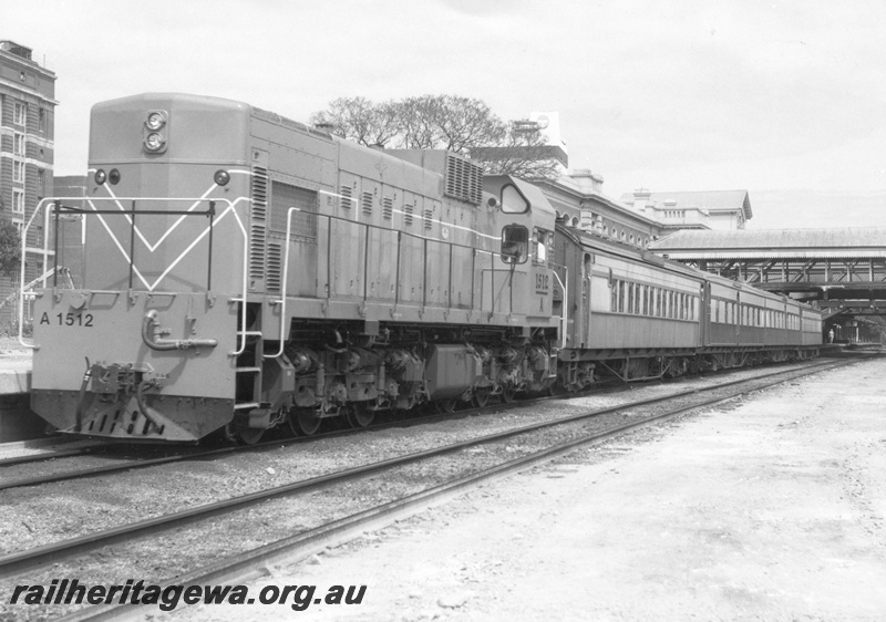 P17057
A class 1512 at the head of the Australind at Perth Station. Note the overhead footbridges and office buildings in the background
