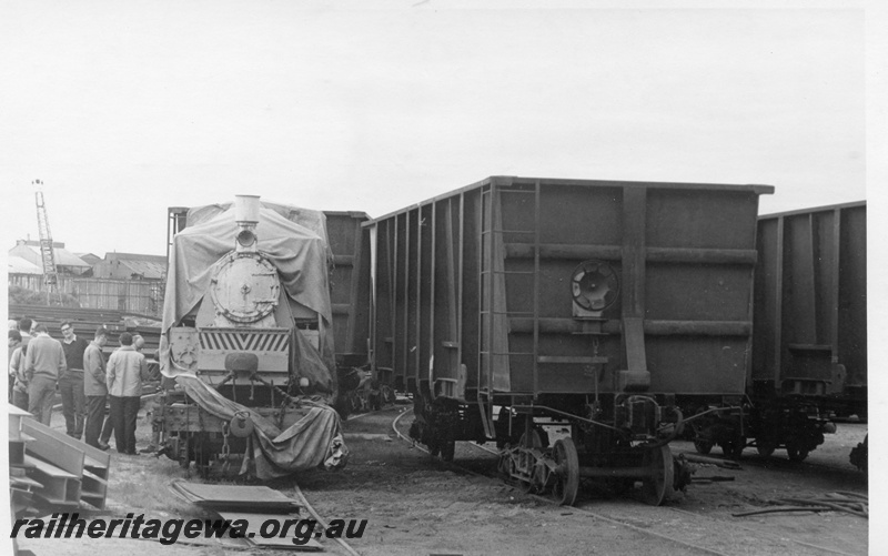 P17094
Orenstein & Koppel steam loco No 4242, iron wagons under construction, Commonwealth Engineering Works Show, Mount Newman, front view, c1968
