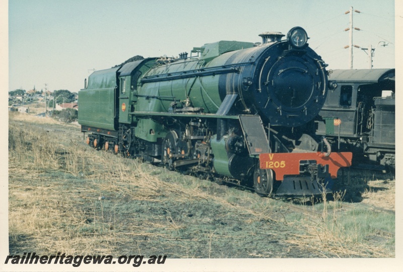 P17157
V class 1205 locomotive at East Perth loco. Unidentified locomotive to side of V class.
