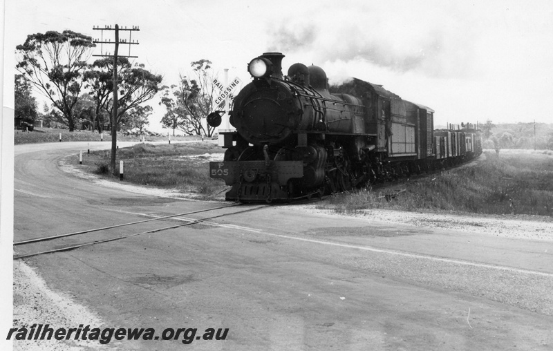 P17351
P class 505 steam locomotive, on goods train, front and side view, on level crossing, near Williams, BN line.

