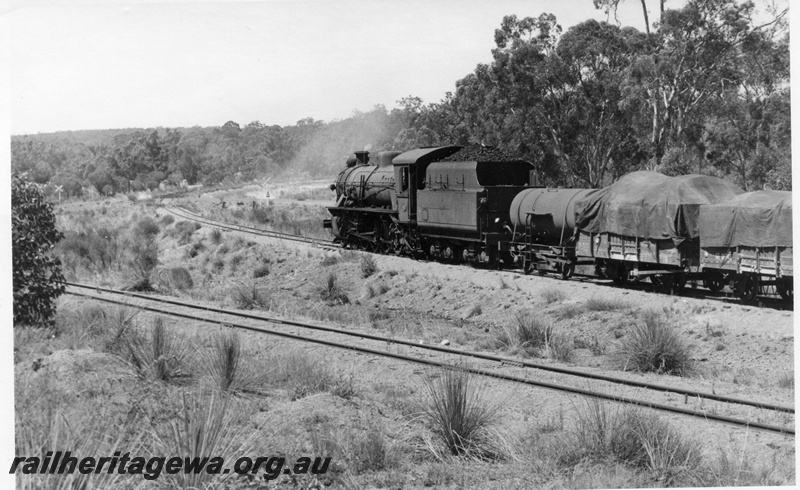 P17360
W class 911 steam locomotive, side and end view, on goods train to Wagin, leaving Bowelling, line on the left is the Narrogin line, BN line.
