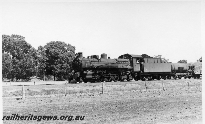 P17387
PMR class 723 steam locomotive on 108 Goods. BN Line. Location Unknown. Note J class water tanker behind loco and distant side view of locomotive.
