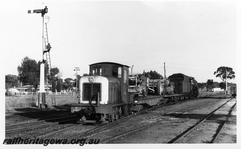 P17468
An unidentified V class steam locomotive hauling 2 loaded flat top wagons and Z class 1151 diesel shunting locomotive at an Unknown location. See P17273.
