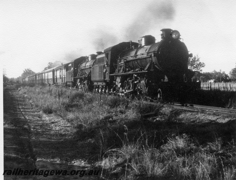 P17617
2 unidentified W class steam locomotives hauling the NSW Rail Transport Museum RESO train at an Unknown location (possibly South West line).
