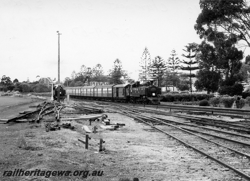 P17636
DD class 596 steam locomotive hauling a Royal Show Special with a white square on the smalebox, unidentified steam locomotive to left and a set of double compound points at left foreground. Signal wiring in foreground., Claremont, ER line.
