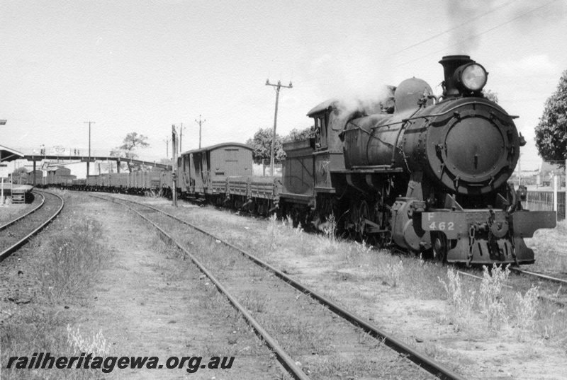P17643
F class 462 steam locomotive shunting at Bassendean. ER line. Front & side view of locomotive. Note the overhead footbridge in background.
