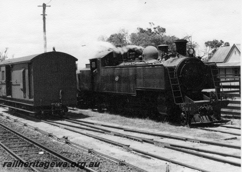 P17654
DM class 581 steam locomotive shunting at Cannington Station. SWR line. Note brakevan to right of locomotive and light pole and overhead light.
