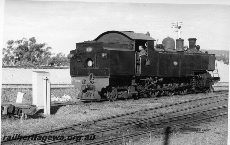 P17724
DD class 598 steam locomotive, running light engine, crew on footplate, end and side view, signals, tracks, relay box,
