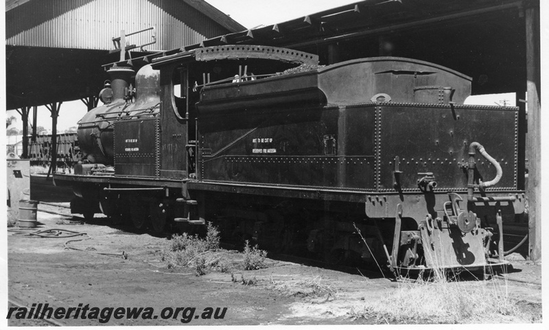 P17739
O class 218 steam locomotive stabled- stored- at the former Northam Loco Depot. ER line. The signage on the tender and front tank side indicates it is not to be scrapped. Side view of tender and loco. The locomotive entered the Museum in 1971.
