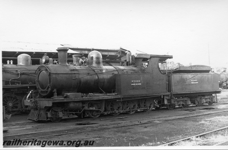 P17740
O class 218 steam locomotive stabled with an unidentified PM class locomotive at old Northam Loco Depot. ER line. Note the main drive rod has been removed and placed on the running board.
