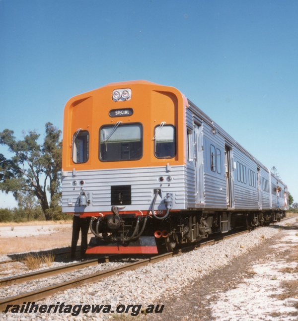 P17942
1 of 6 views of an ADL/ADC two car railcar set on an ARHS tour to Gingin, MR line, ADC class 851 at Muchea, front and side view 
