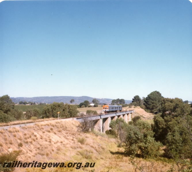 P17943
2 of 6 views of an ADL/ADC two car railcar set on an ARHS tour to Gingin, MR line crossing the steel girder bridge at Upper Swan. 
