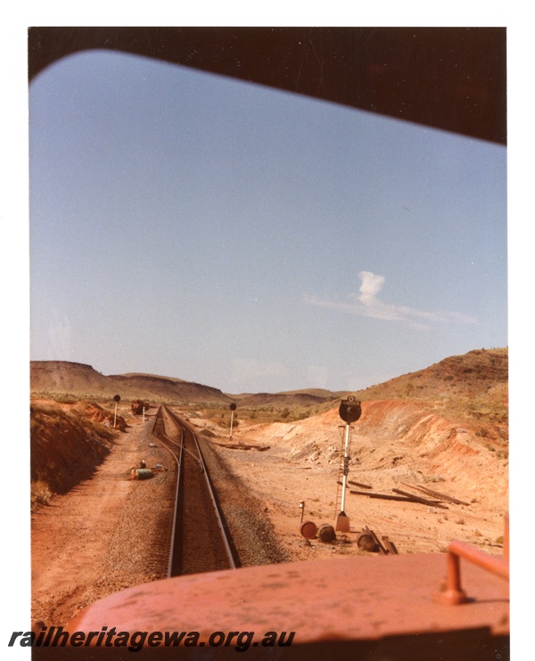 P18748
Mount Newman (MNM) driver view of empty train approaching Garden siding. 
