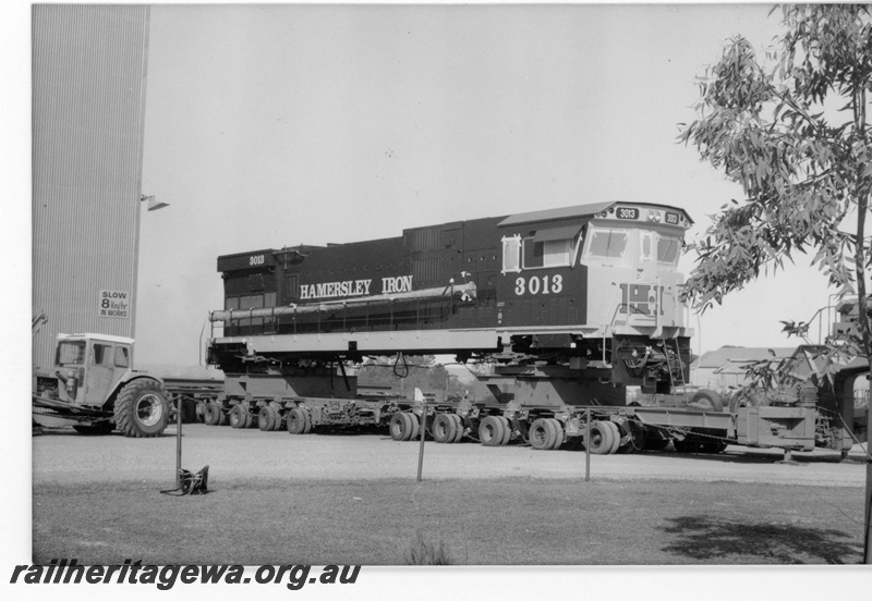 P18802
Hamersley Iron(HI) C636R class 3013 after rebuilding with Pilbara cab. Locomotive on low loader in Comeng Bassendean works for transport to Dampier. 
