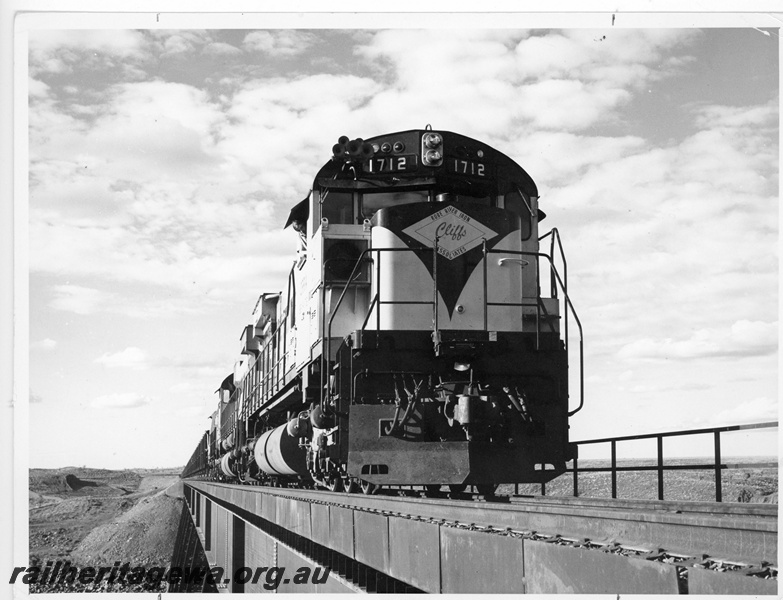 P18810
Cliffs Robe River (CRRIA) M636 class 1712, 1710 RSC-3 class 1705 crossing Fortescue River hauling an empty train to Pannawonica. 
