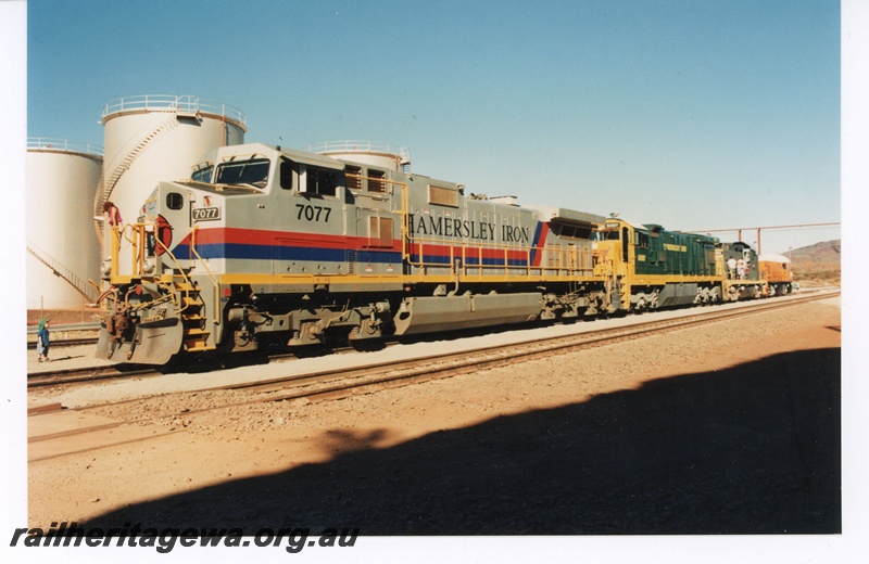 P18838
Hamersley Iron (HI) C44-9W class 7077, C36-7 class 5057, C415 class 1000, GML B class 1 at Paraburdoo. C415 class and GML B class owned by Pilbara railway Historical Society. 
