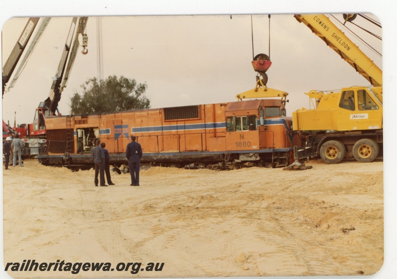 P19622
N class 1880 being lifted by 3 cranes following a level crossing accident with a truck at Wagerup. SWR line.
