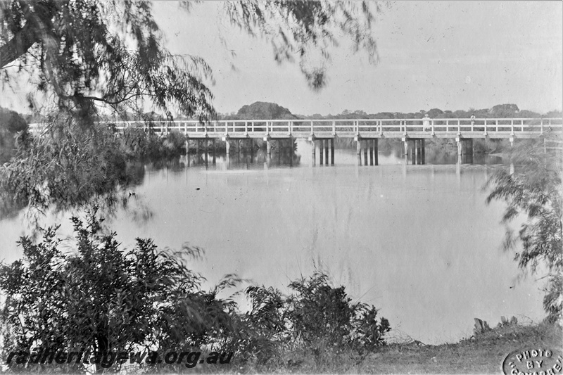 P19700
Timber trestle railway bridge over the Vasse River, Busselton, overall view looking across the river
