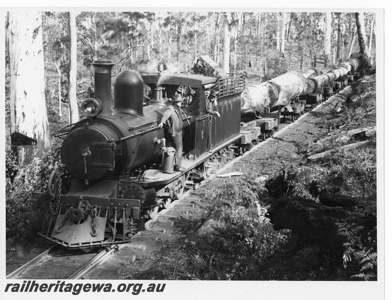 P20024
State Saw Mills loco No 6, with extended smokebox acquired whilst working for WA Manganese Co on their Meekatharra to Horseshoe line about 1932, on a karri log rake, crew, Treen Brook near Pemberton, front and side view
