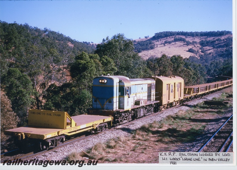 P20038
H class 1 on Kalgoorlie to Kwinana Rehabilitation Project rail train, including van and flat wagons loaded with rails, on wrong line, Avon Valley line, end and side view
