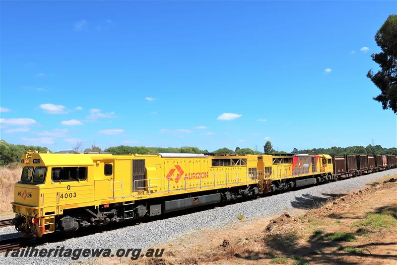 P21001
Aurizon C class 4003, yellow livery with a red Aurizon logo double heading with Aurizin Q class 4001 with the yellow with red and grey areas livery on a south bound freight train through Hazelmere.
