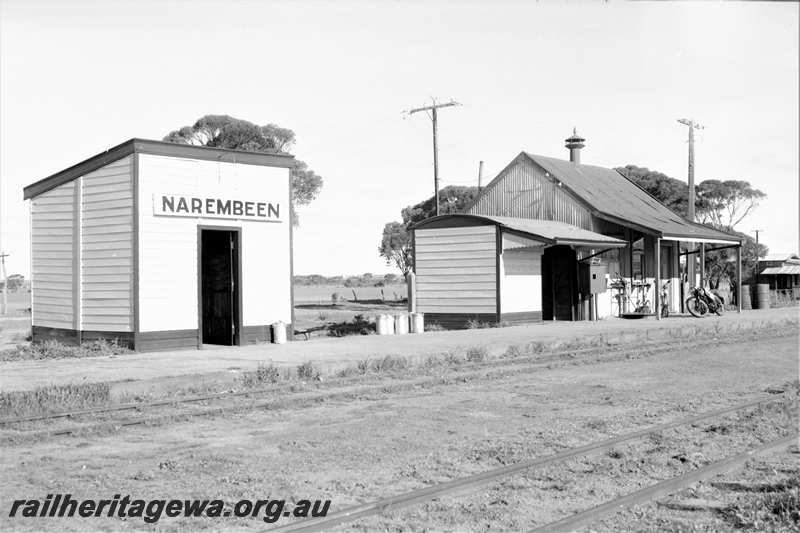 P21608
Station buildings, station sign, platform, tracks, Narembeen, NKM line, view from track level 
