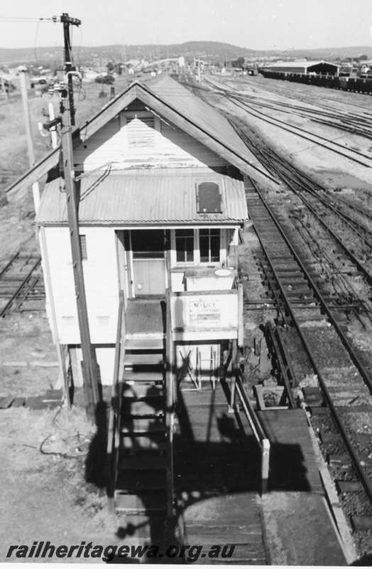 P21642
Signal Box B,  entry stairs and door, tracks, wagons, shed, Midland, ER line, looking east from an elevated position
