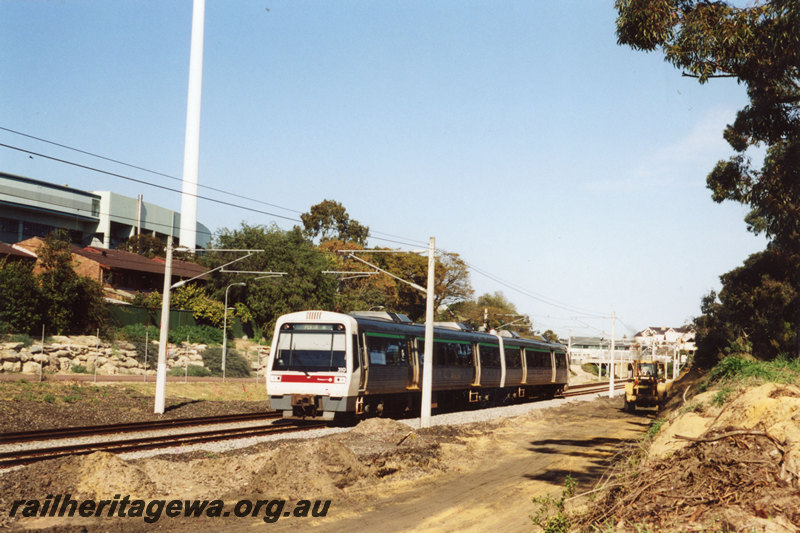P22890
Earthworks between West Leederville and Subiaco for construction of special events platform near Subiaco Oval. Two car A series railcar in photo. ER line.
