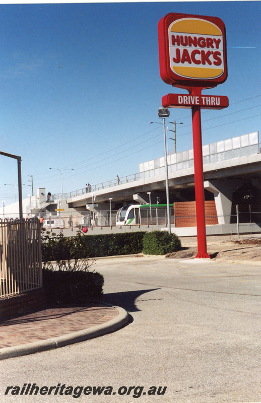 P22892
Thornlie Station - opening day, B series railcar in platform, Spencer Road bridge and Hungry Jacks sign.
