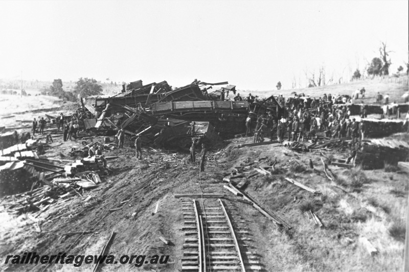 P23018
Mornington Mills disaster at Wokalup 1 of 2, debris of wagons, ripped up track, workers, bush setting, Wokalup, SWR line, incident occurred on 6 November 1920
