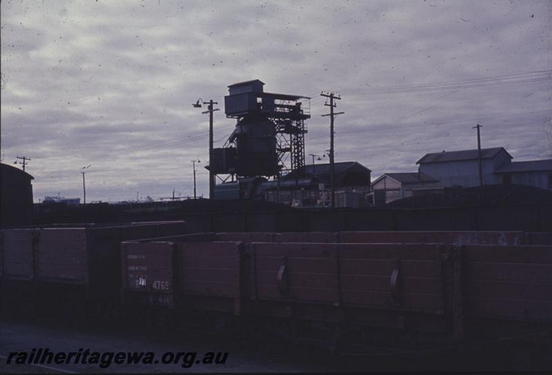 T01234
R class 4769 bogie open wagon, coaling tower, Bunbury. R 4769 entered service in 1900, converted to a QBB class flat wagon in 1970 and written off in 1973.
