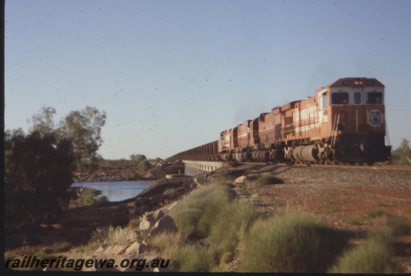 T01664
Mount Newman Mining locos coming off bridge, iron ore train, C36-7M class 5513.
