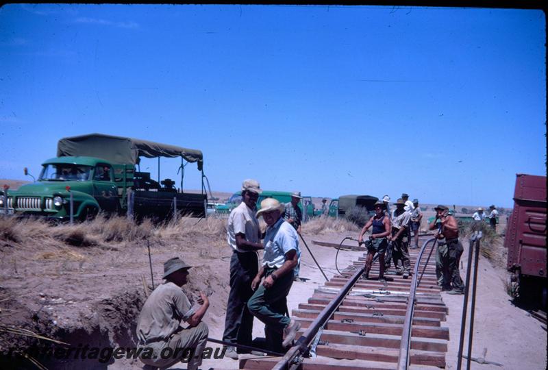 T02966
Five of ten photos of a derailment at Dongara, MR line, gangers repairing the track
