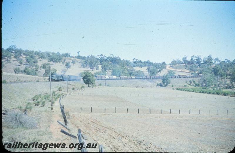 T03248
Distant view of X class double heading with a V class, approaching Swan View, ER line, goods train
