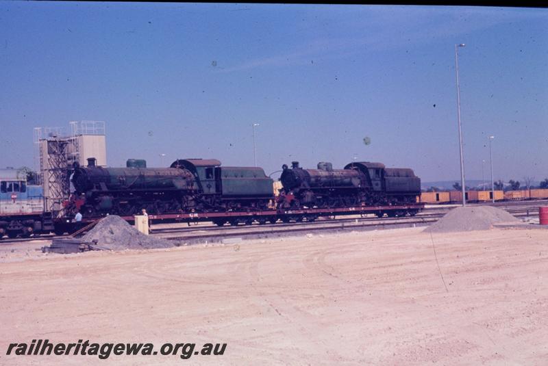 T03404
W class 933 and W class 934, Forrestfield Yard, on standard gauge flat wagons

