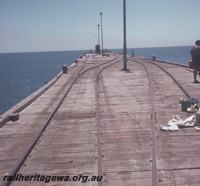 T04183
Jetty at a north west port, probably Point Samson, view along jetty showing railway tracks.
