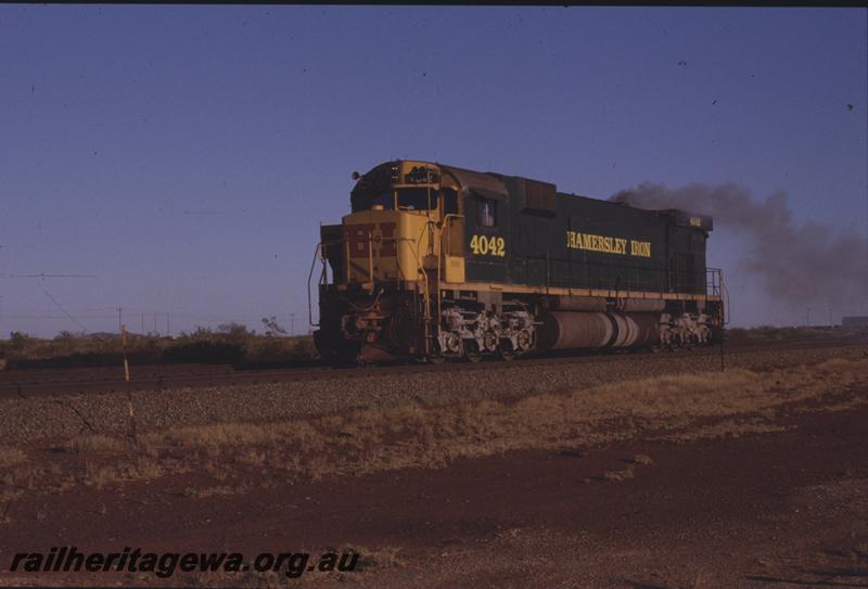 T04244
 RIO line, Hamersley Iron Alco locomotive M636 4042 runs light engine towards Parker Point, Dampier, 7 Mile,
