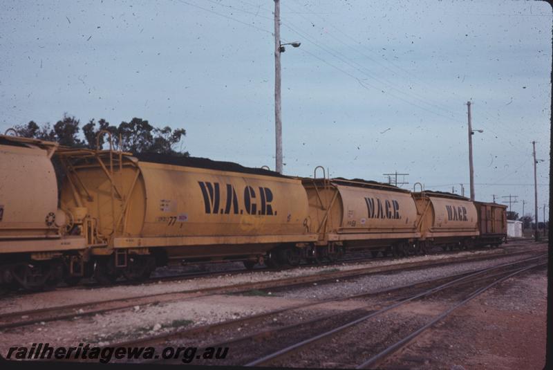 T04272
Narrow gauge coal hopper on a coal train, Kwinana Yard, view along the rake of wagons .

