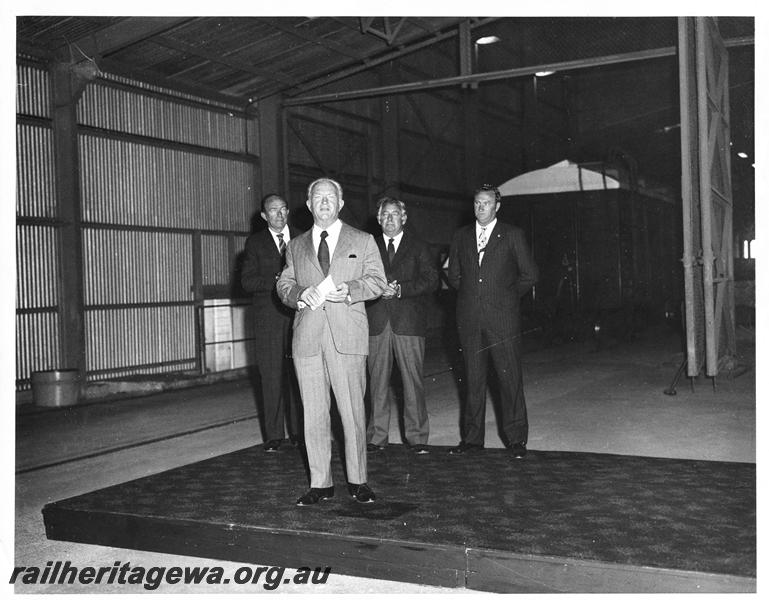 P00215
Mr R. J. Pascoe, Commissioner of Railways, Mr R. O'Connor, Minister for Railways, RCH class wheat wagon in background, ceremony at Avon Yard
