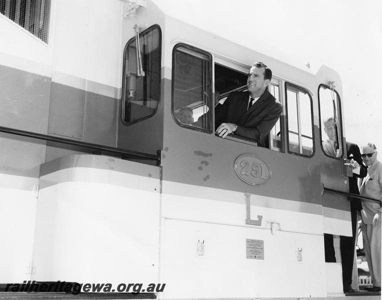 P00251
L class 251, view of cab, Minister for Railways Mr R. O'Connor leaning out of the cab window at the handing over ceremony of the loco. (ref: Railways Institute Magazine, Vol 64, December 1964, page 16)
