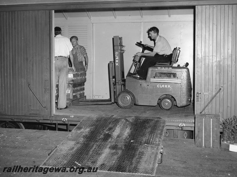P00276
VF class bogie van, being loaded by a forklift, view through the doorway. 
