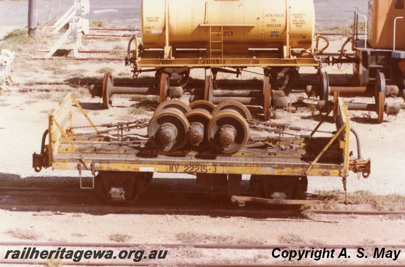 P01305
NV class 22215 wheel carrying wagon, yellow livery, front view, J class 1213 tanker marked 
