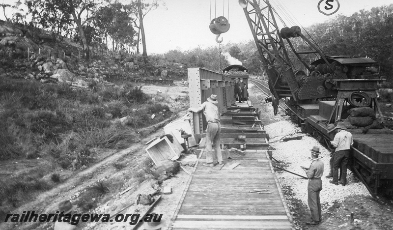 P01432
7 of 13 images of the construction of the duplicate steel girder bridge No.1 at 16 miles 25 chains on the ER through the John Forrest National Park, one of the main girders being lifted from the wagons
