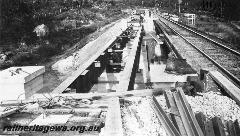 P01437
12 of 13 images of the construction of the duplicate steel girder bridge No.1 at 16 miles 25 chains on the ER through the John Forrest National Park, view along the bridge with girders in place

