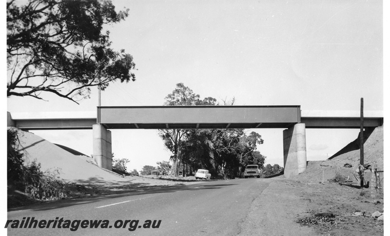 P01483
Steel girder rail overbridge, over South West Highway, Mundijong, Kwinana to Jarrahdale line side view from road level, same as P0774
