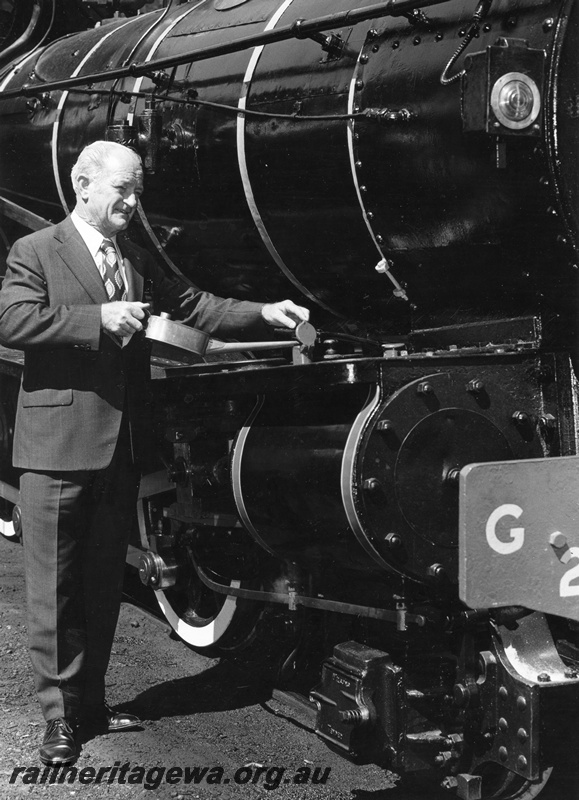 P01544
1 of 3 views of the Commissioner of Railways, Mr R Pascoe posing in front of G class 233, 