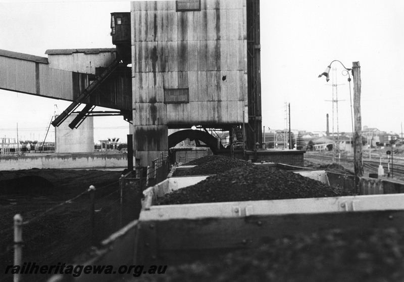 P01620
Rotary coal unloader, South Fremantle Power House, view along the top of the wagons into the unloader
