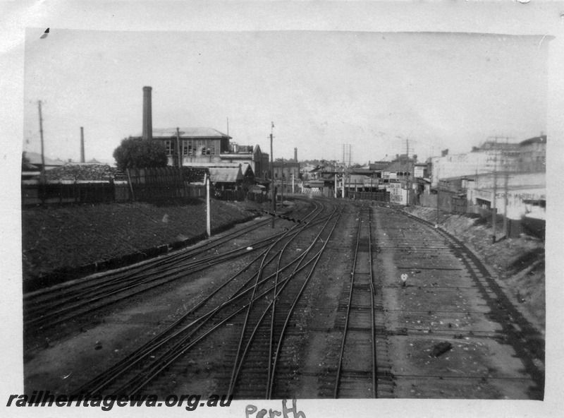 P01694
Perth station, approach from east end showing complex trackwork, view looking towards Fremantle, ice works on the left.
