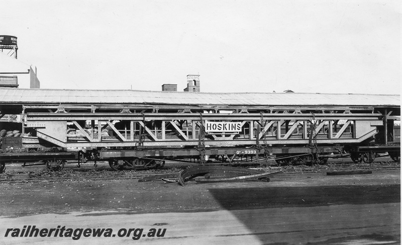 P01773
2 of 3 views of QA class 9393 bogie flat wagon carrying an over length electric crane traverser for the Great Boulder Mine, loaded at Perth Goods Yard, side view.
