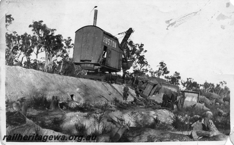 P02016
14 of 14. Ruston steam shovel on embankment clearing derailed side tipping wagons, side and front view, head walls on culvert of embankment, construction of Denmark-Nornalup railway, D line.
